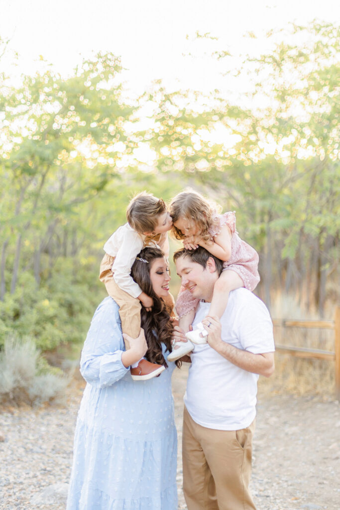 Candid family photograph of family together in the poppies at Lambert Park in Utah County during a summer portrait session