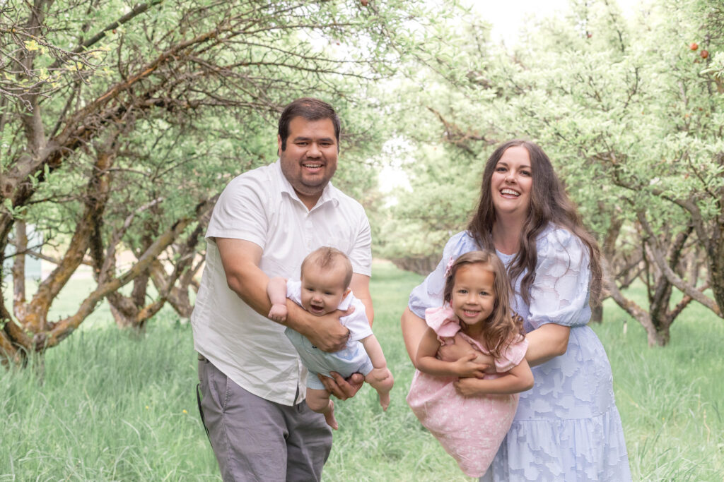 Playful, relaxed spring family photography session in a Utah orchard setting